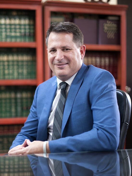 Portrait of Matthew Holley, experienced attorney specializing in civil litigation and personal injury cases. Fluent in Spanish, with over 15 years of legal experience.